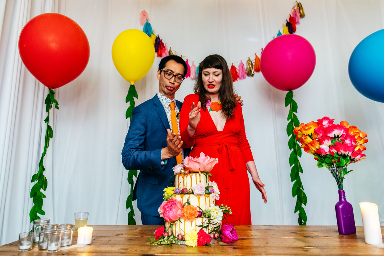 Ash Barton Estate Wedding Cake Cut Ballons tongues out no knife Karate chop