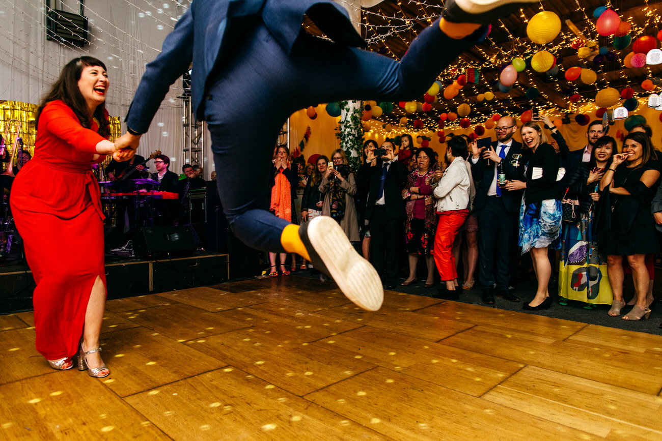Ash Barton Estate Wedding Groom takes off on dancefloor during first dance 