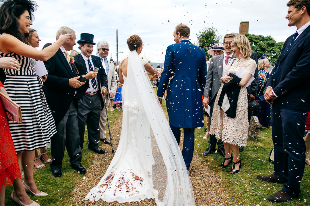 Confetti shot from behind couple in Old Northamptonshire